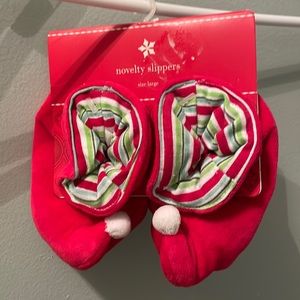 Elf Holiday booties size large New, still attached to the packaging.